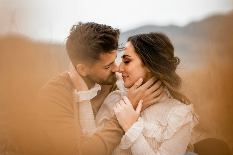 A couple embracing in a golden field