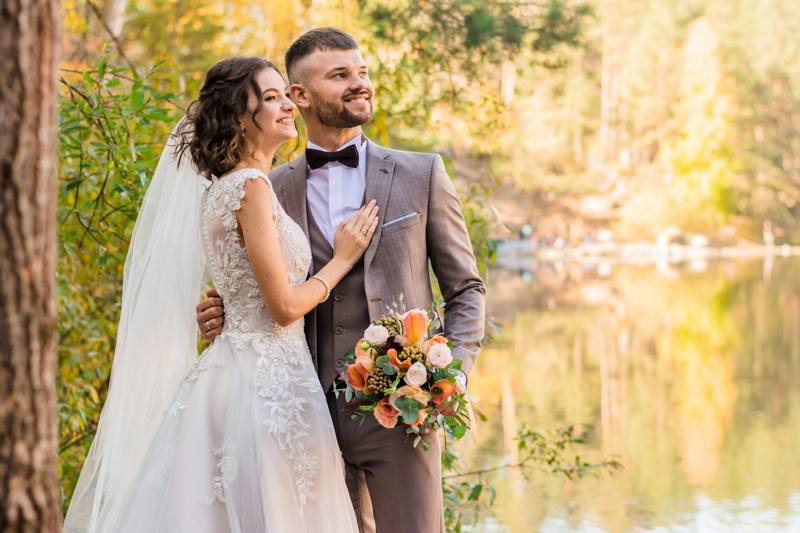 Man in gray suit and woman in white wedding dress